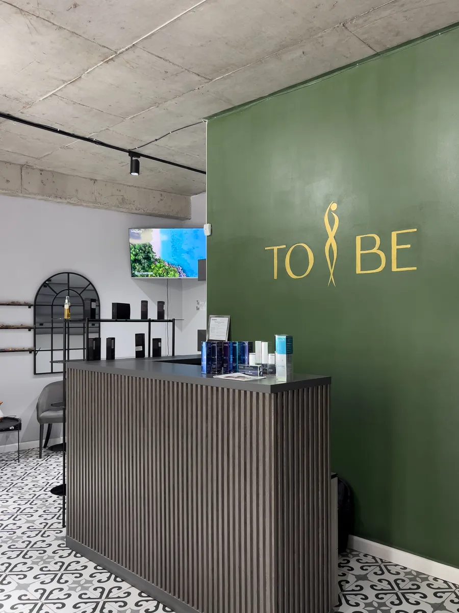 Reception — the TO BE brand wall · TO BE Tbilisi